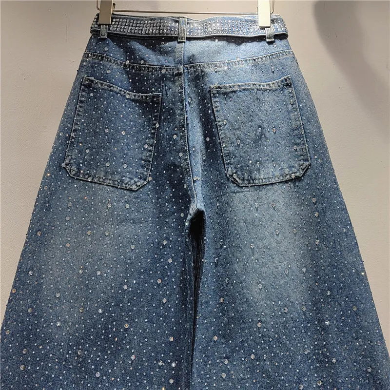 

Star-embellished wide-leg jeans. Vintage wash with detachable ribbons. Statement artisan denim, uniquely you.