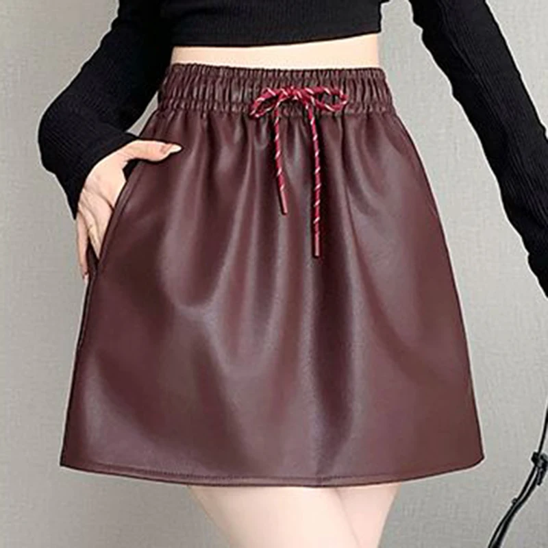 

Lace up elastic waistband PU leather skirt for women in 2024 autumn, new retro style sexy, slimming, hip hugging short skirt