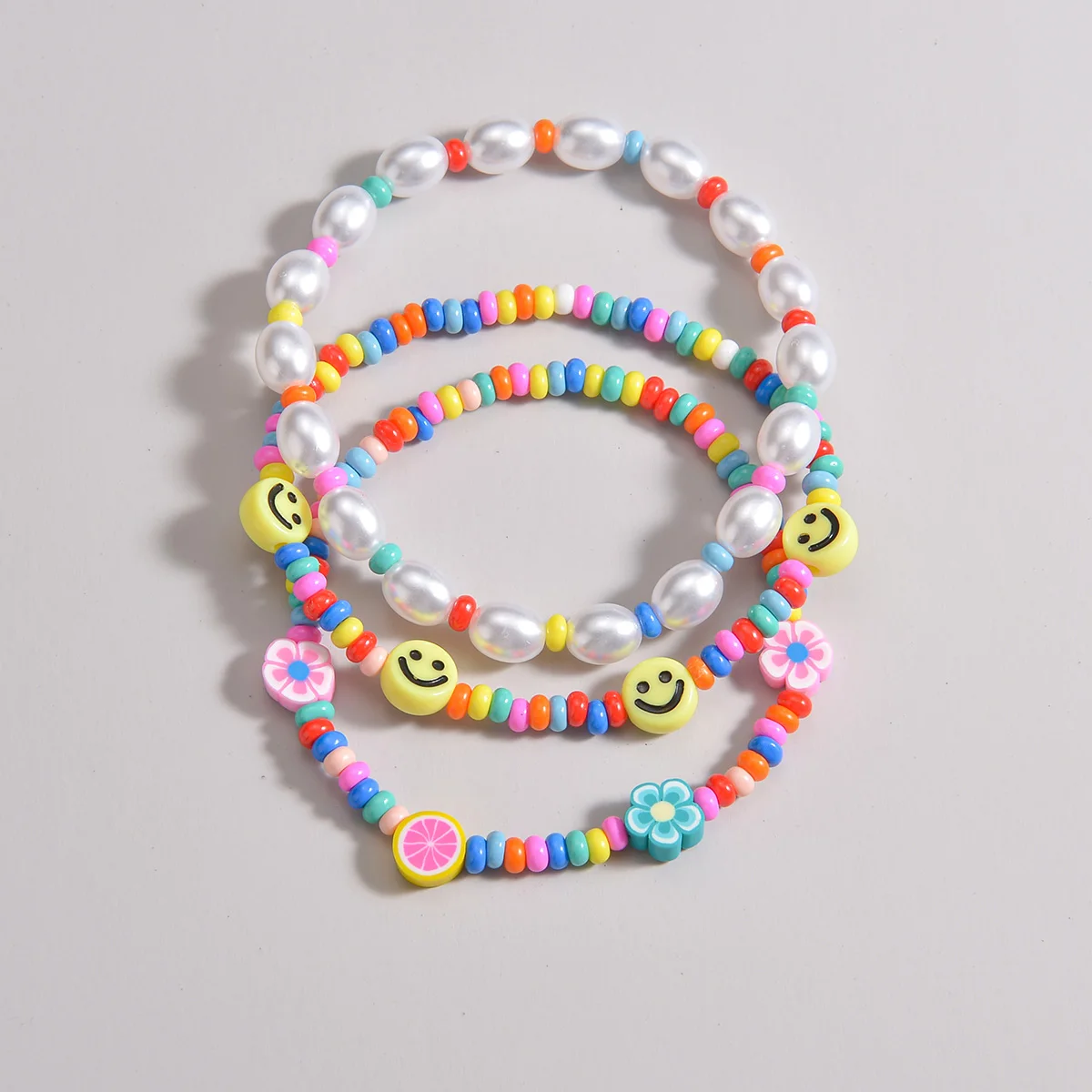 3-piece set of Bohemian style colorful rice beads mixed with smiling face pearls, multiple layered women\'s anklets