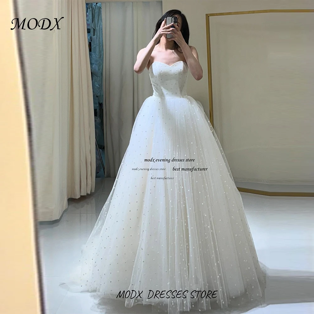

MODX Customized Shinny Sweetheart Neck Bride Wedding Dresses Sleeveless Sleeves Glitter Open Back Bridal Modern Ball Gown