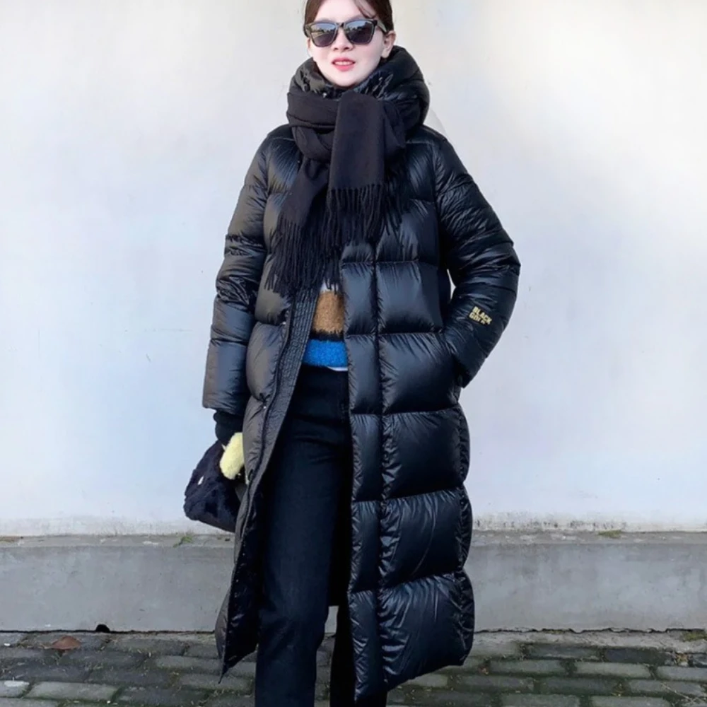 Manteau en duvet d'oie blanc chaud nouveau 2025 noir or huit grilles femmes veste longue épaissi stockage de chaleur à la mode doudoune