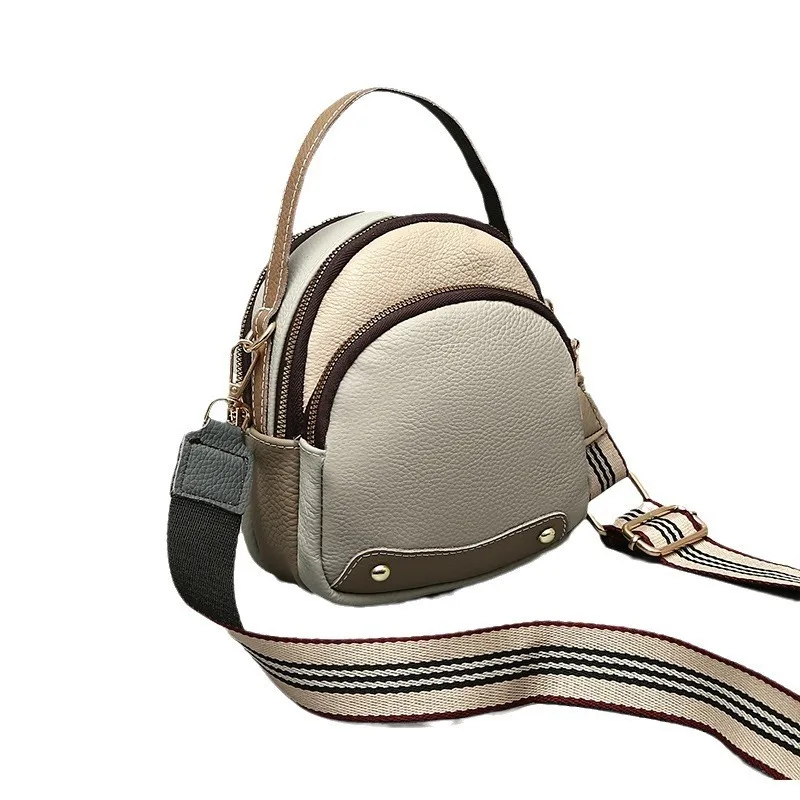 KK   New top-level cowhide small fashionable splicing, color, duck egg bag, large capacity commuting women's bag