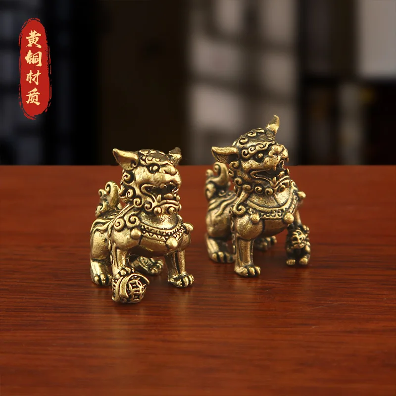 A pair of brass lion figurines, miniature lions creating a micro-landscape, suitable for office desks, home decor, or as tea