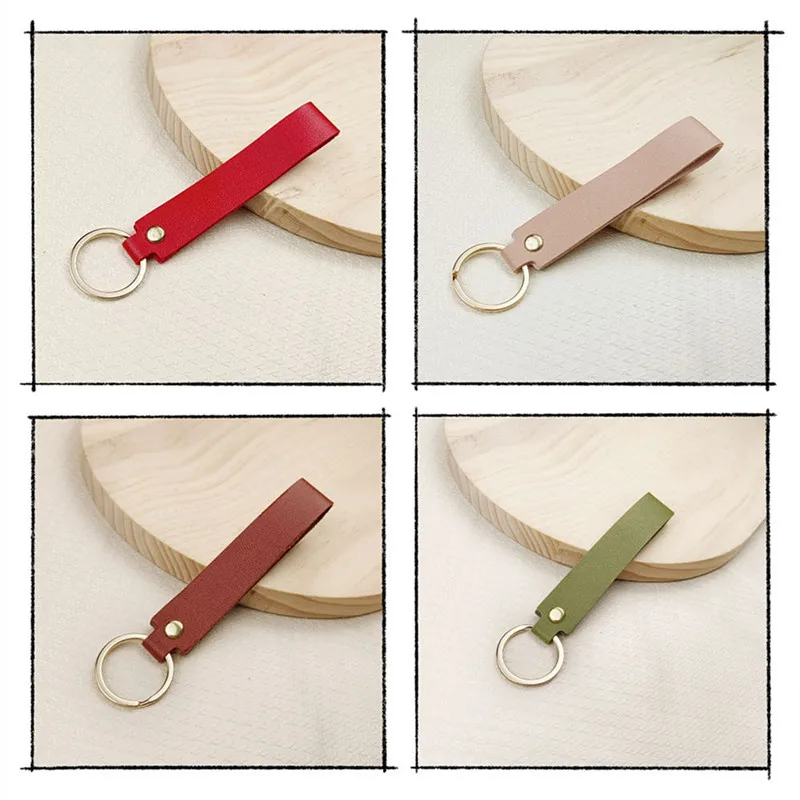 Versatile Solid Leather Key Buckle Handle rope bag Pendant Doll Portable strap Fashionable Couple car Keychain Accessories