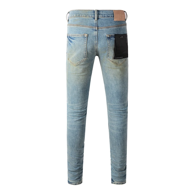 Pantaloni Jeans con fori strappati a mosca con bottoni Streetwear americani elasticizzati Indigo elasticizzati leggeri da uomo