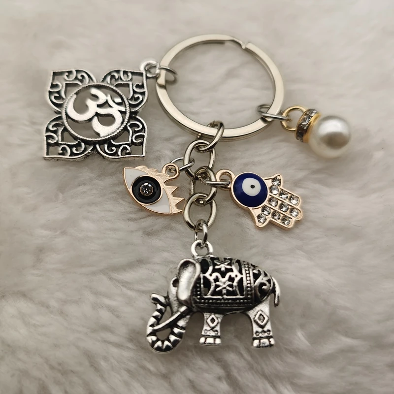Llavero religioso Vintage, colgante de elefante, Buda, budista, palma, Ojo de Ángel, loto, regalo de recuerdo, bolsa, encanto, moda Linda