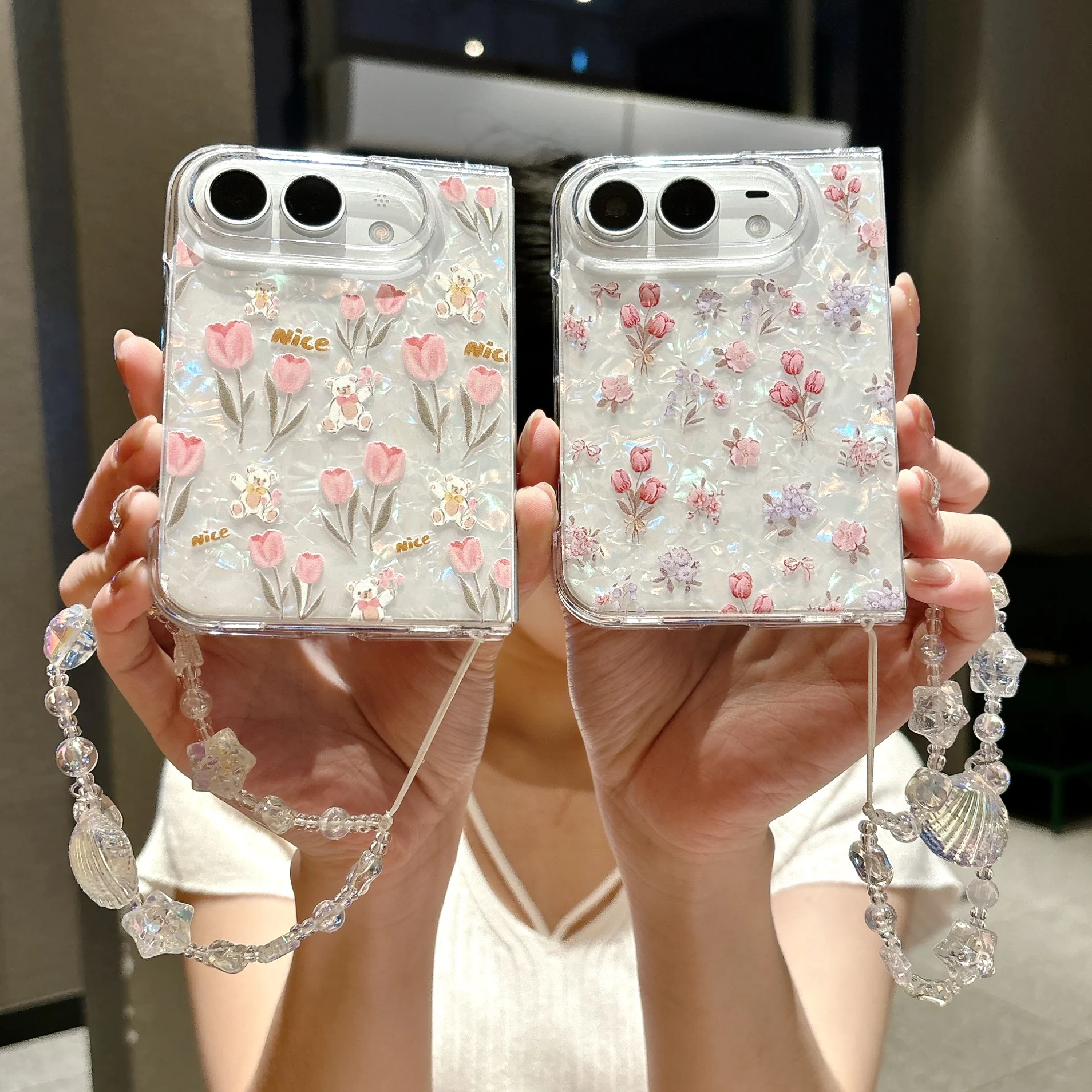 Cute Shell Pattern Flower Bracelet Case‌ for iPhone Ultra 18 Fold Wide Shockproof Lens Protrusion Comfortable Grip Slim Cover