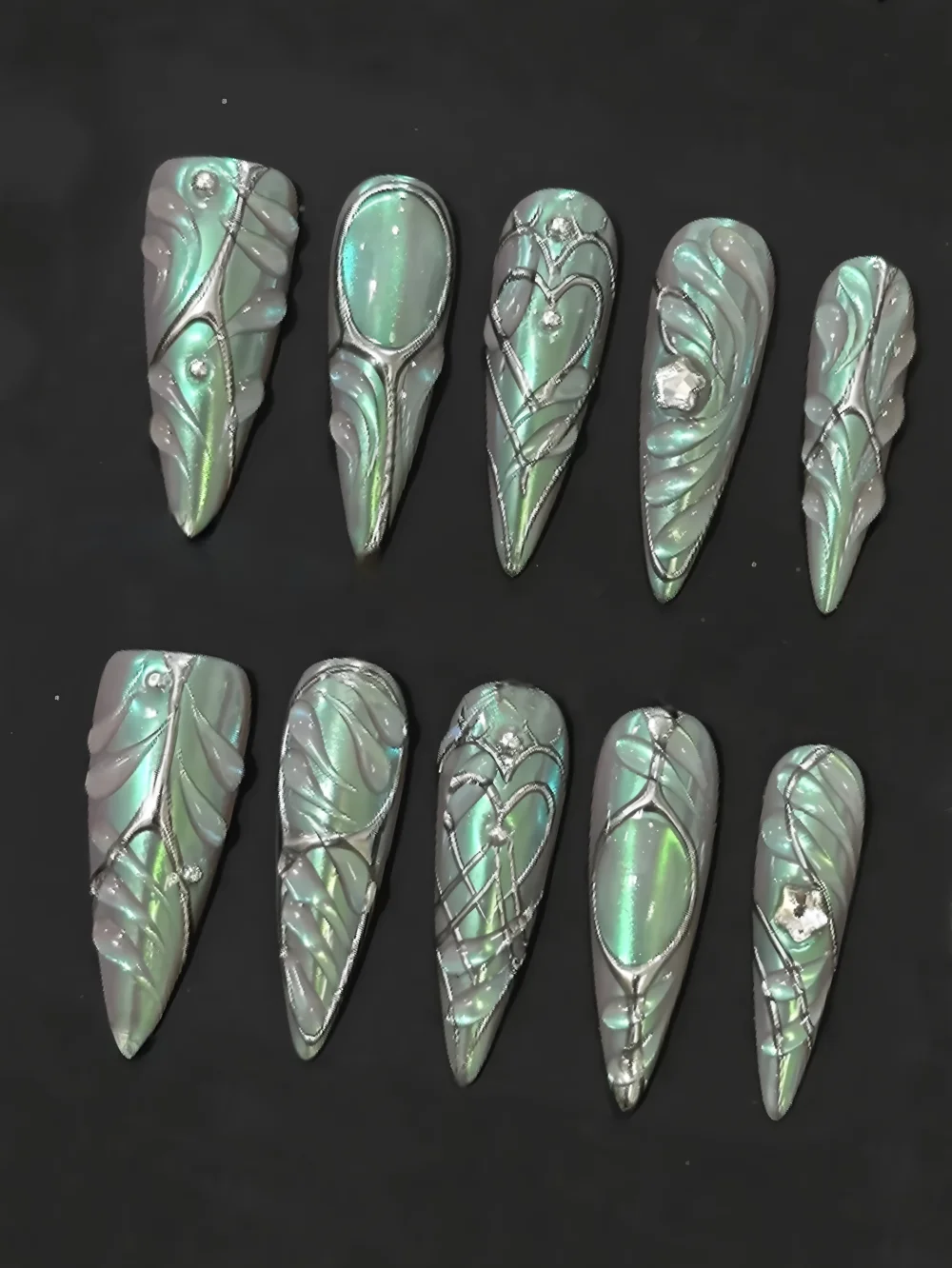 A set of 10 handmade press-on nails featuring a mint-colored iridescent pearlescent finish; minimalist design; reusable; suitabl