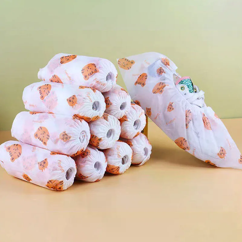 ถุงคลุมรองเท้าแบบใช้แล้วทิ้งลายการ์ตูนหนา 50 ชิ้น, ถุงคลุมรองเท้ากันลื่นสำหรับใช้ในบ้าน, ถุงคลุมรองเท้าระบายอากาศได้