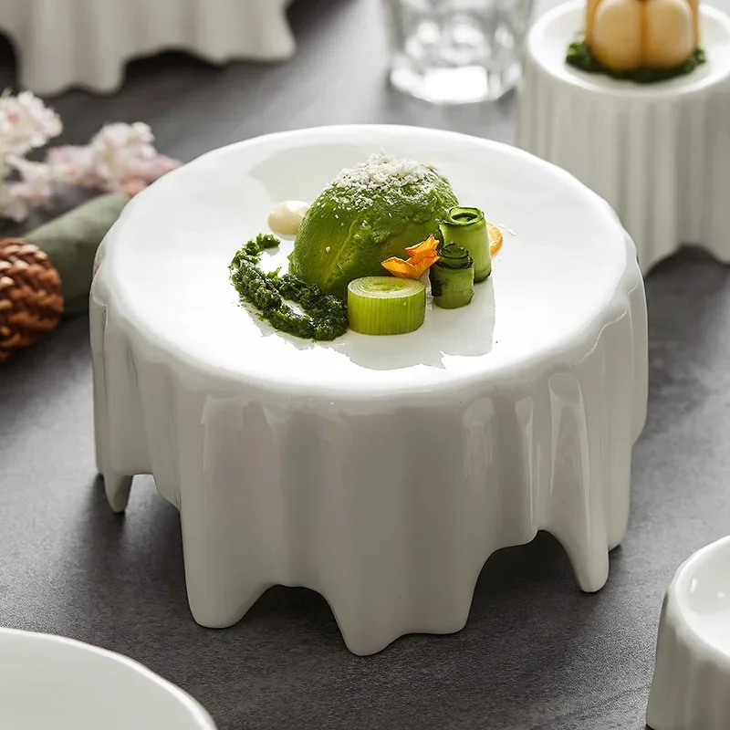 high foot plate, artistic conception, dishes, tableware, restaurant features, irregular western food plate, white plate, round