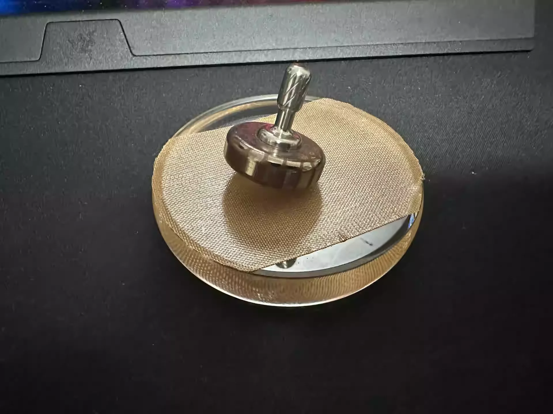 Superconducting hand twisted gyroscope with glass base