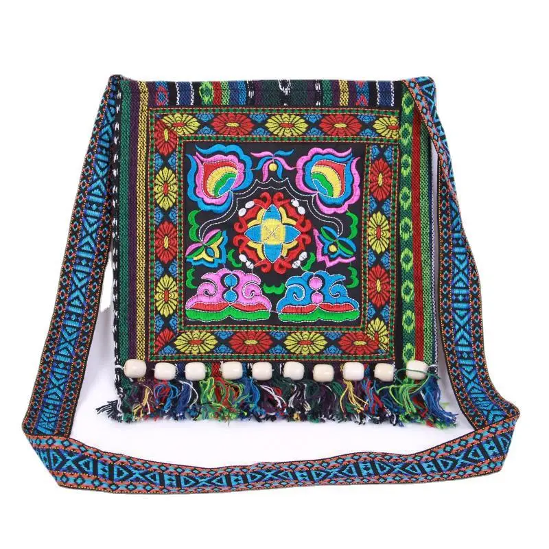 2023 new Yunnan ethnic style embroidery bag striped cloth embroidery single shoulder oblique span tassel camellia bag