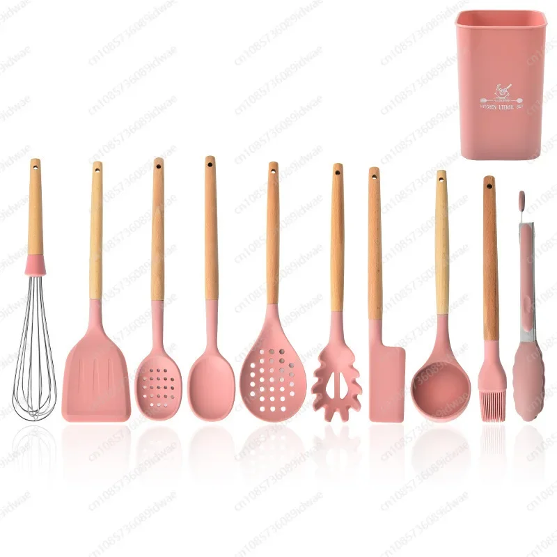 

11-Piece pink silicone cookware with wooden handles for cooking and baking