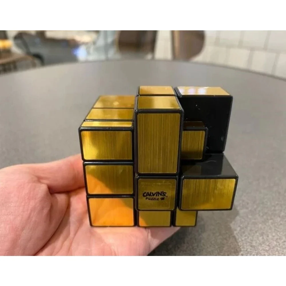 

Calvin's Puzzle 3x3 Cube Gray Mirror Illusion Siamese II (Black Body, Gold Label) in Small Clear Box Cast Coated Magic Cube Toys