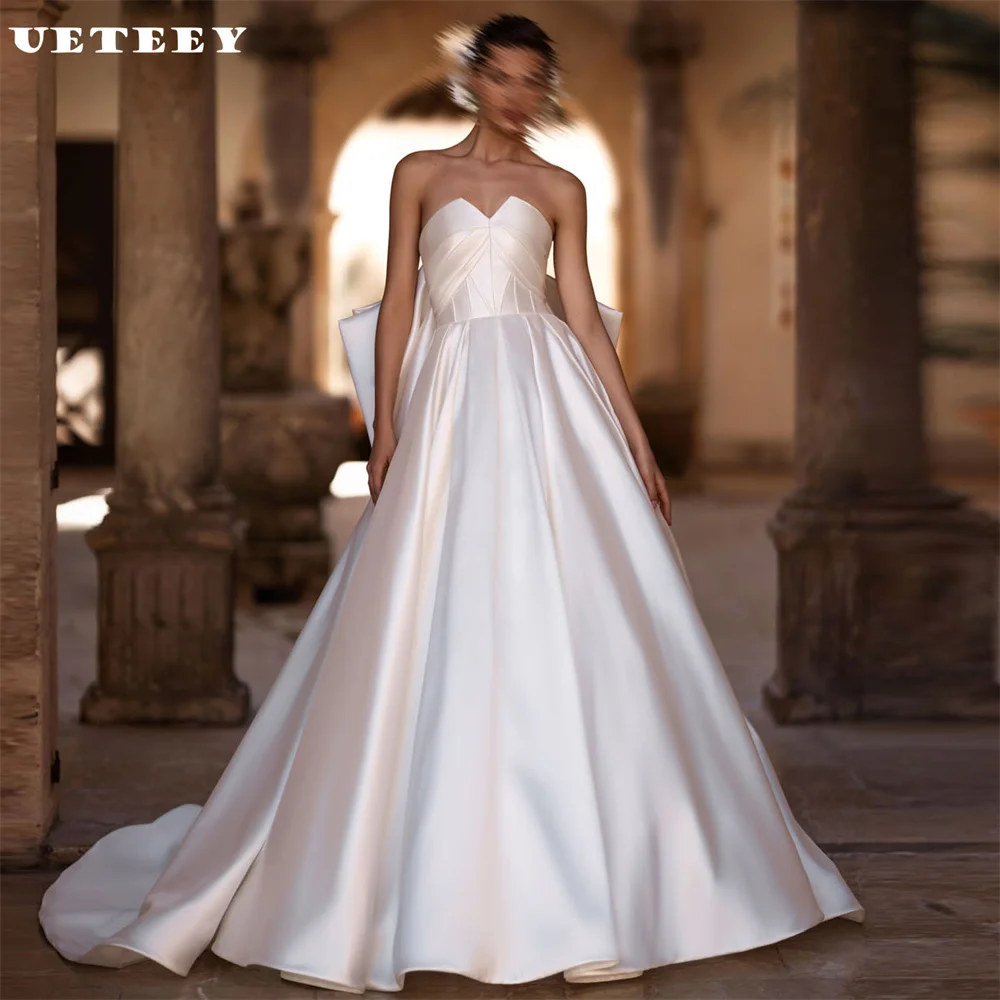 

UETEEY Customized V Neck Sleeveless Satin Pleats Wedding Dress Big Bow Elegant A Line Lace Up Back Court Train Bridal Gown