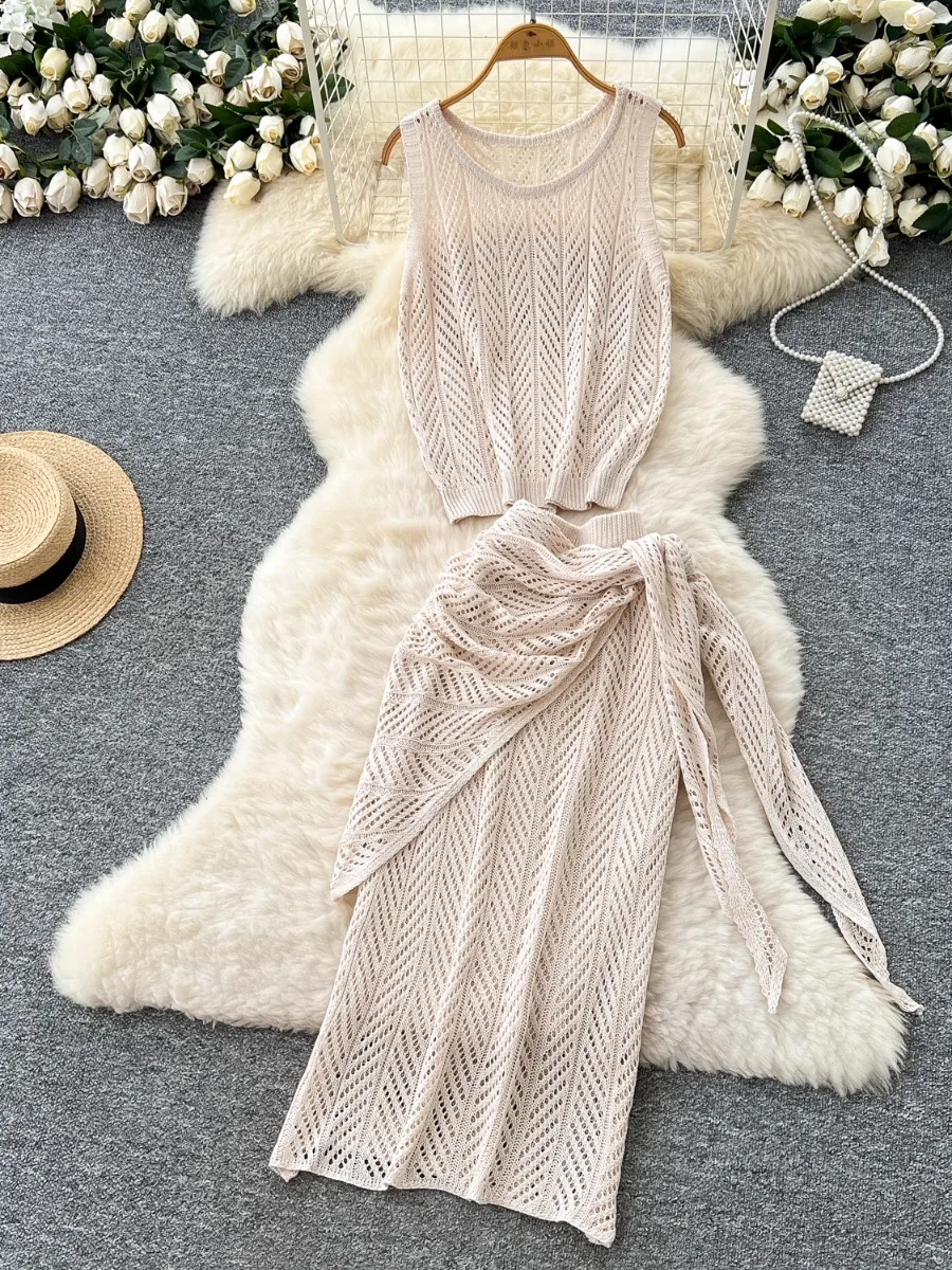 

Foamlina Trendy Hollow Out Sleeveless O-neck Knit Top & Tie Up Cinched Waist Half Skirt Two Piece Set Vacation Outfit Suit