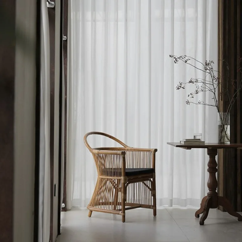 Sedia da pranzo in rattan fatta a mano artistica Wabi Stillwind Sedia per il tempo libero con balcone in rattan per piante indonesie