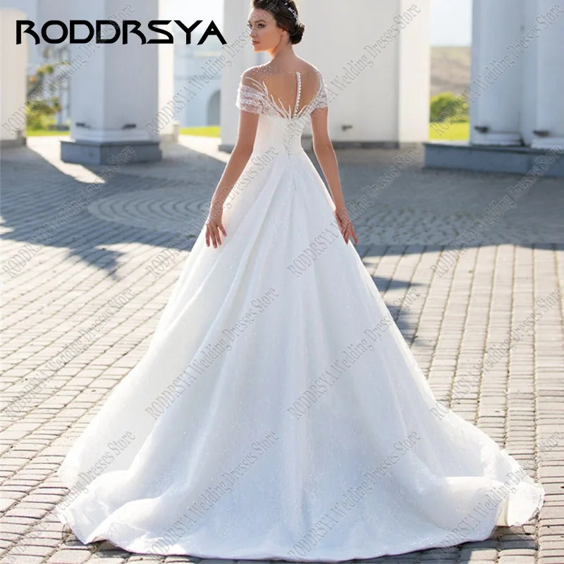 RODDRSYA رومانسية تول زين المحكمة فستان الزفاف أنيقة الترتر س الرقبة Vestidos De Novia مثير زر الظهر حفلة العروس رومانسية تول زين المحكمة فستان الزفاف أنيقة الترتر س الرقبة Vestidos De Novia مثير زر الظهر حفلة العروس