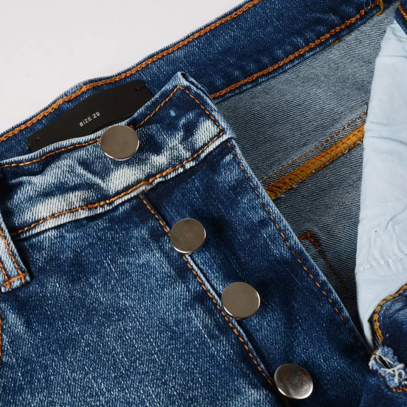 Hombre designer's fashionable new jeans, washed with nostalgia, stretchy, slim fit, perforated with cashew flower patch, light b