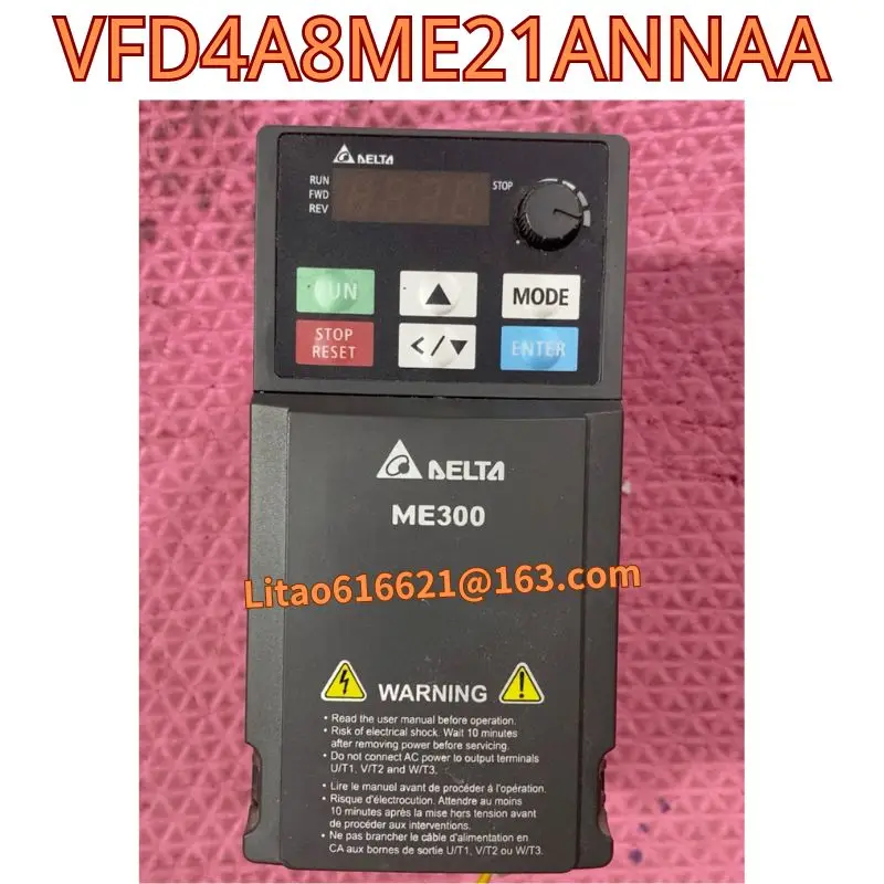 The second-hand original frequency converter VFD4A8ME21ANNAA has been functionally tested and is intact in appearance