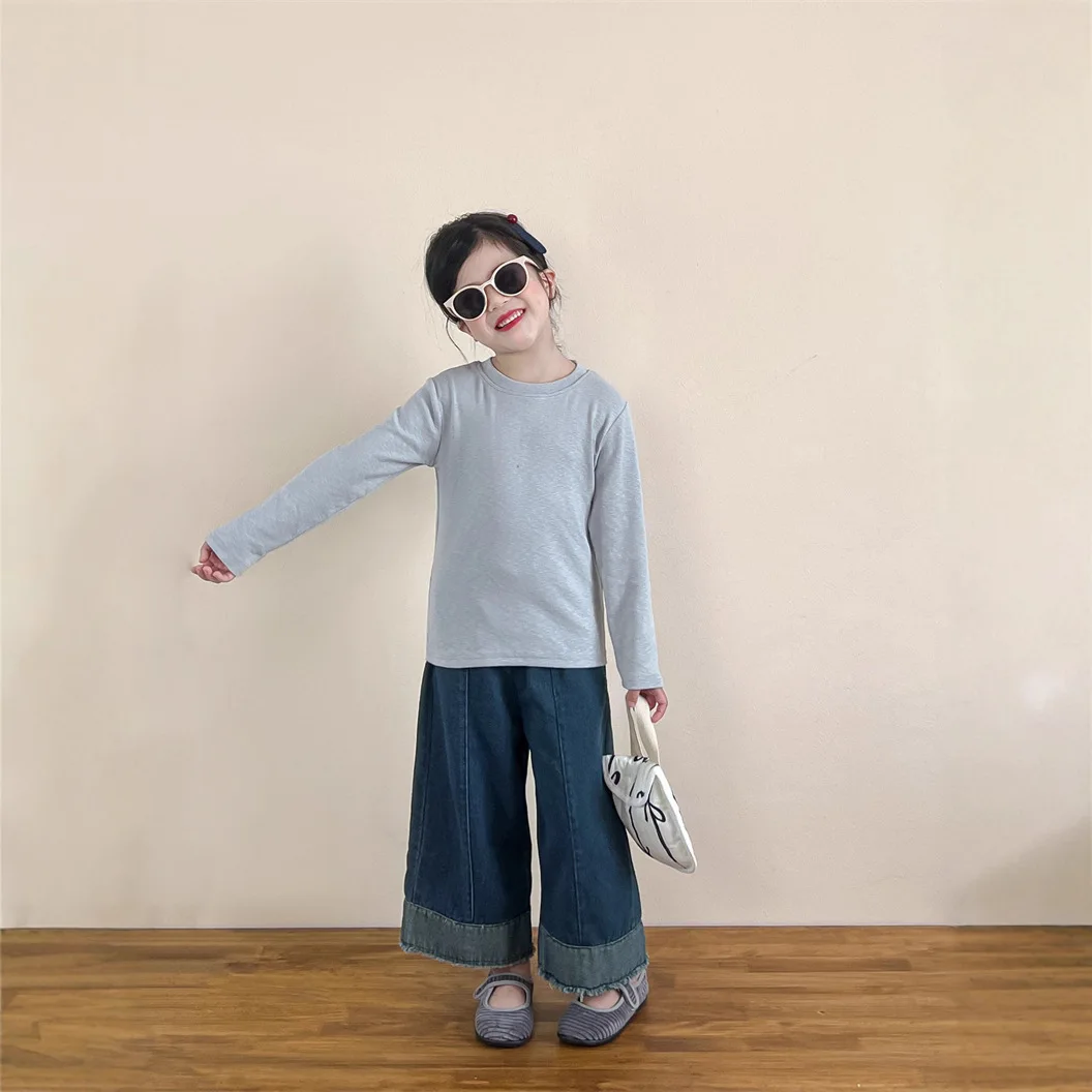 أطفال الخريف الربيع أسفل قميص 2025 جديد الكورية المألوف الفتيات الفتيان بلون طويل الأكمام بسيطة عادية اليومية تي شيرت