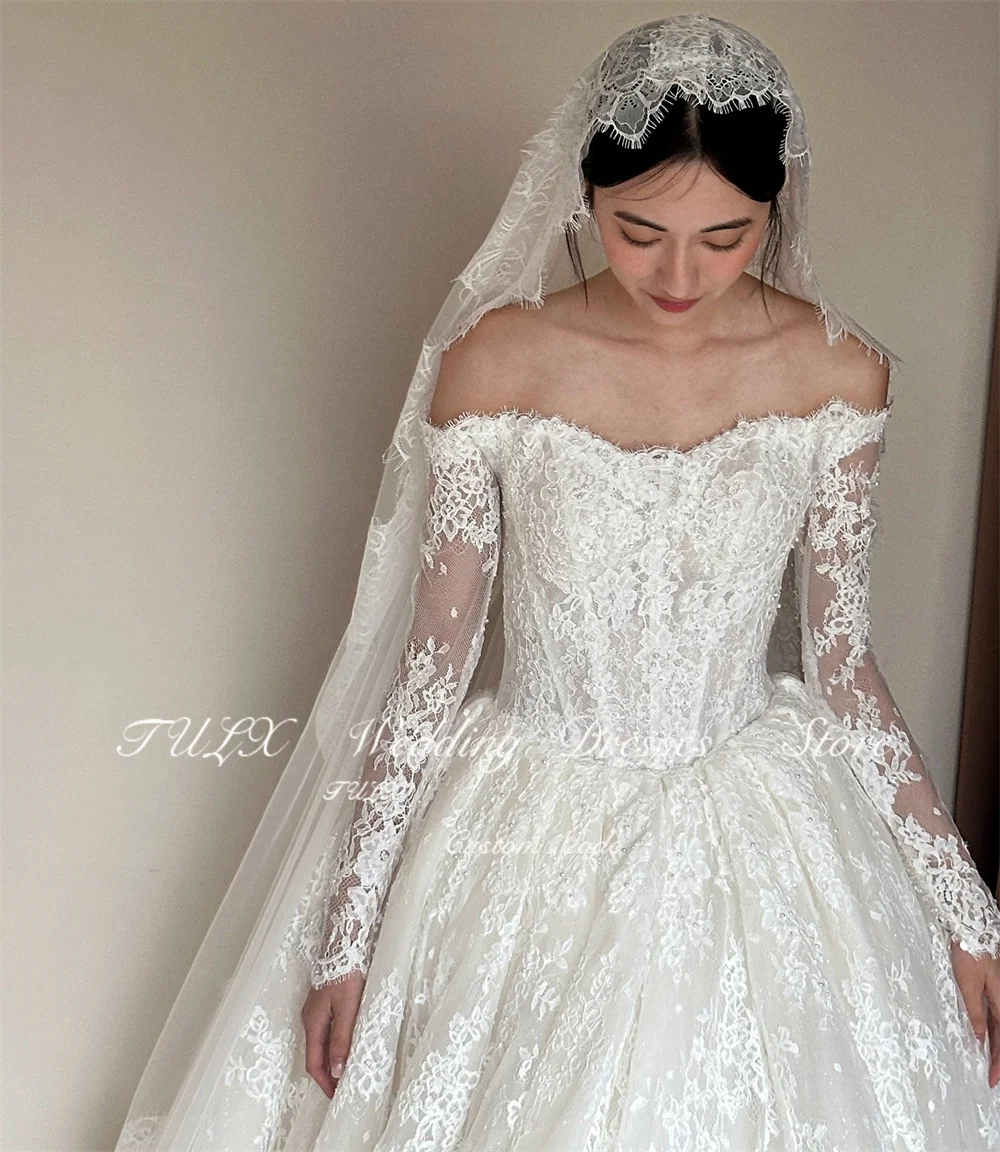 ชุดแต่งงานลูกไม้สีงาช้างหรูหรา TULX สไตล์เกาหลี ถ่ายรูป ชุดเจ้าสาวแขนยาวเปิดไหล่ คอร์เซ็ทสั่งตัดได้ 웨딩드레스