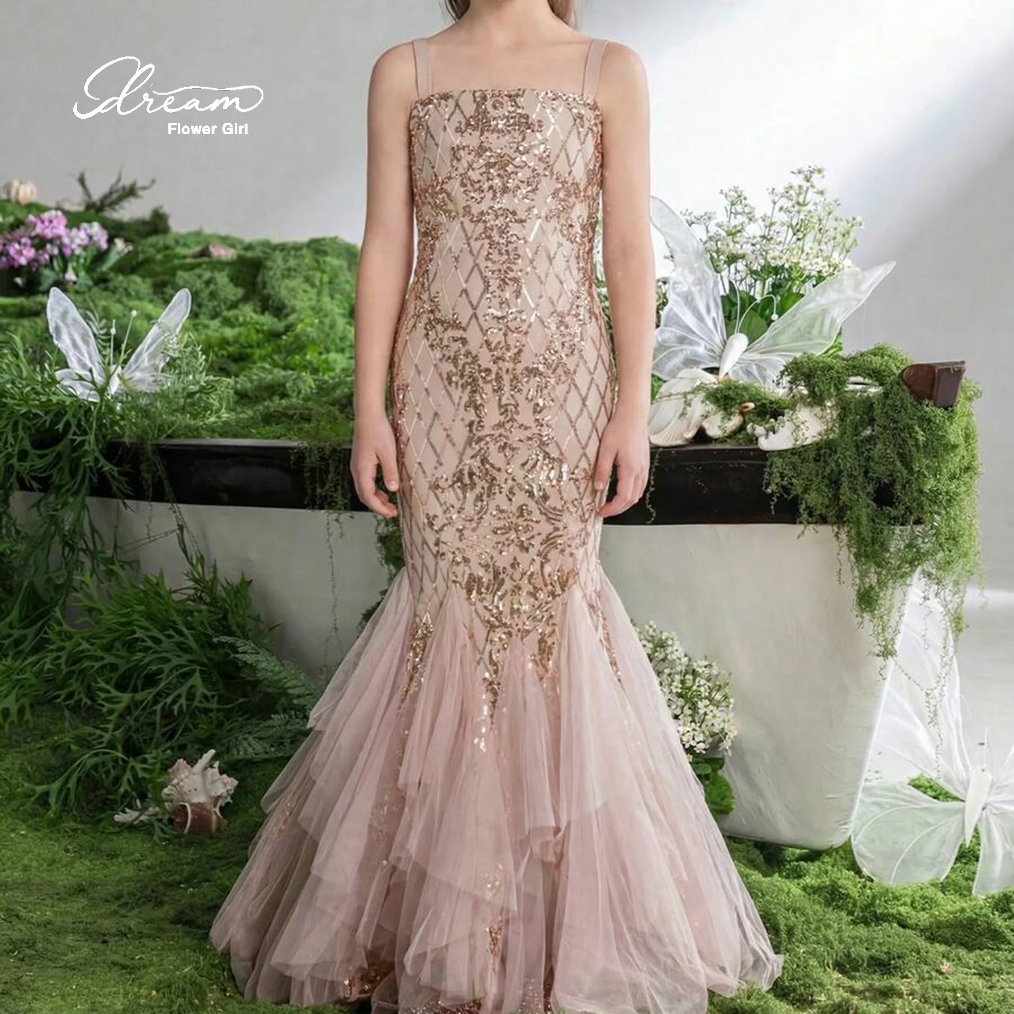 Champagne-colored strapless mermaid-style formal gown for girls featuring a bodice with printed embroidery and a tulle skirt