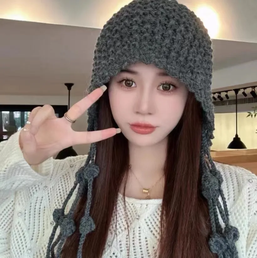 Fashion handwoven tassel ball wool hat warm ear strap knit hat