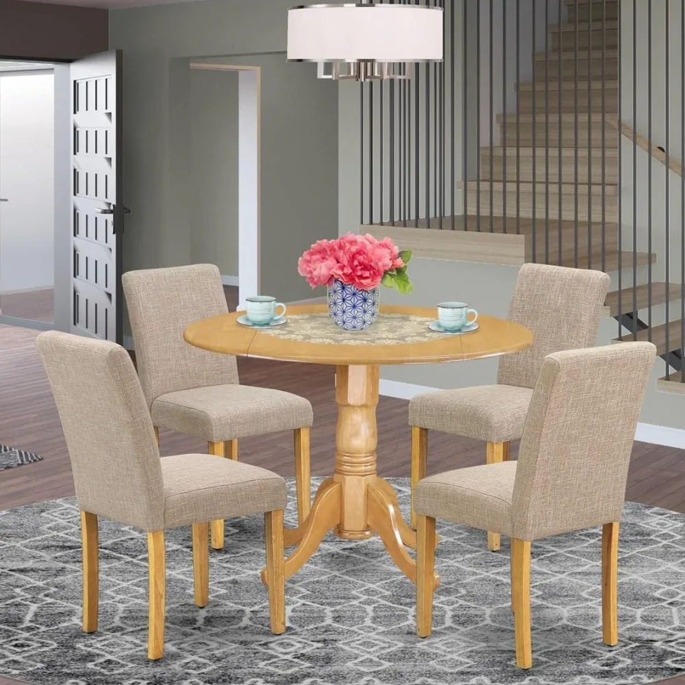 5 Piece Dining Table and Chair Set Includes a round dining table with hanging leaves and 4 linen Parsons dining chairs