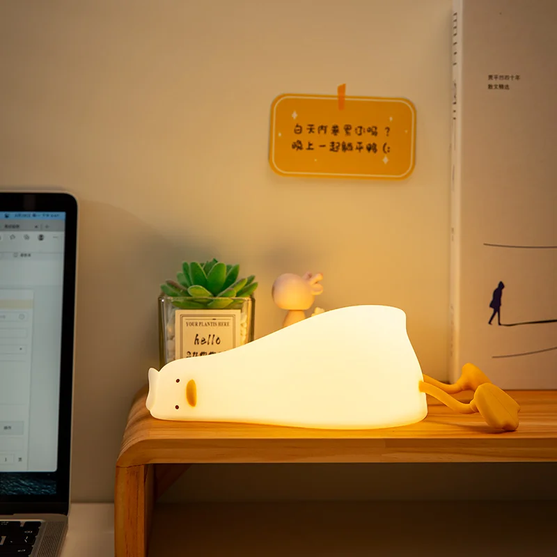 Lying Flat Duck Night Light Silicone Squishy Rechargeable Tap Control 3 Brightness 30 Min Timer Phone Holder for Bedside view 3