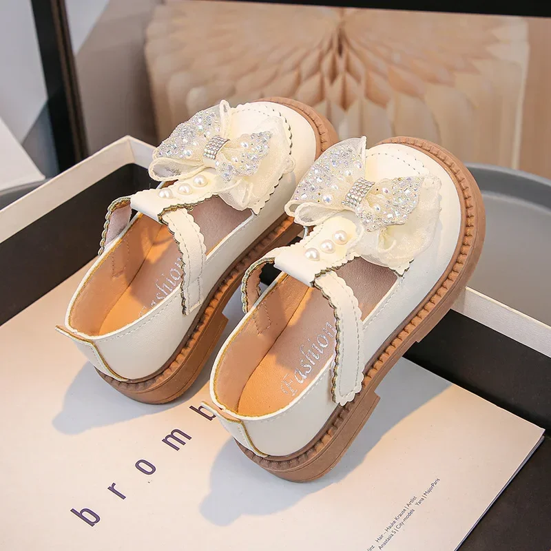 

Girls Leather Shoes T-strap Shiny Sweet Bows 2025 Fashion Kids Flat Shoes Non-slip Soft Sole Children Princess Shoes Round Toes