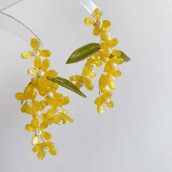 Boucles d'oreilles fleur jaune à long pompon pour femmes, bijoux de déclaration florale, design unique Osmanthus Fragrans, élégant
