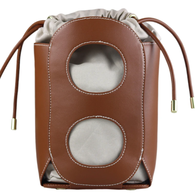 

PG Women Shoulder Bag Retro Hollowed Out Bucket Design High End Niche Design Versatile Daily Commuting Drawstring Crossbody Bag