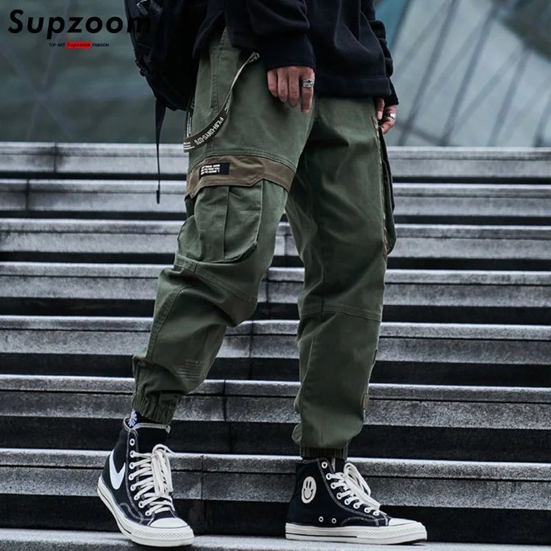 Supzoom 2025, recién llegado, pantalones holgados con cintura elástica y bolsillos de longitud completa, pantalones de ocio con logotipo Popular para hombre, pantalones Cargo de algodón