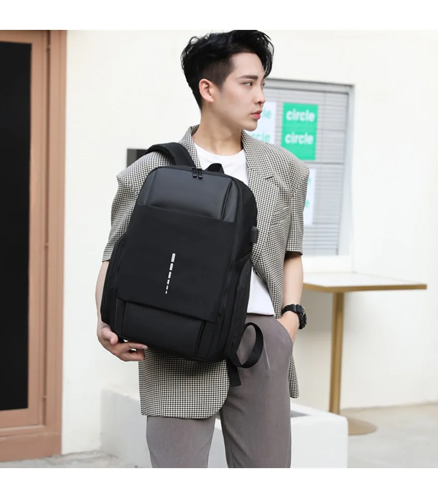 Gray and black color block laptop backpack vertical front reflective dotted strip side built in external USB anti splash padded