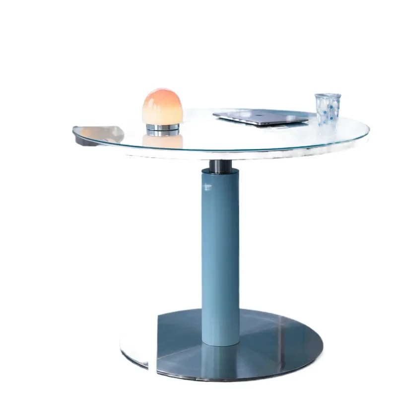 A small Korean-style apartment with a round dining table, featuring a dining table made of solid wood and stainless steel