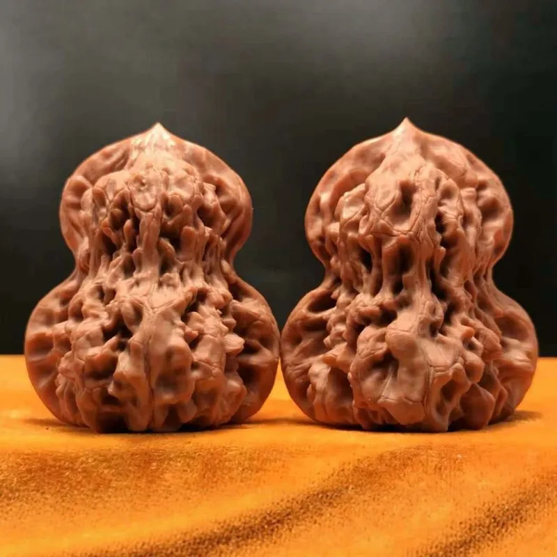 Handcrafted uniquely shaped and carefully selected pieces of Wenshan hemp walnuts paired with hand-held ornaments featuring