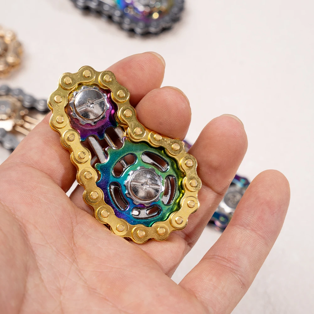 1 لعبة دوارة متململة على شكل سلسلة دراجات معدنية ملونة، فعالة في تخفيف التوتر