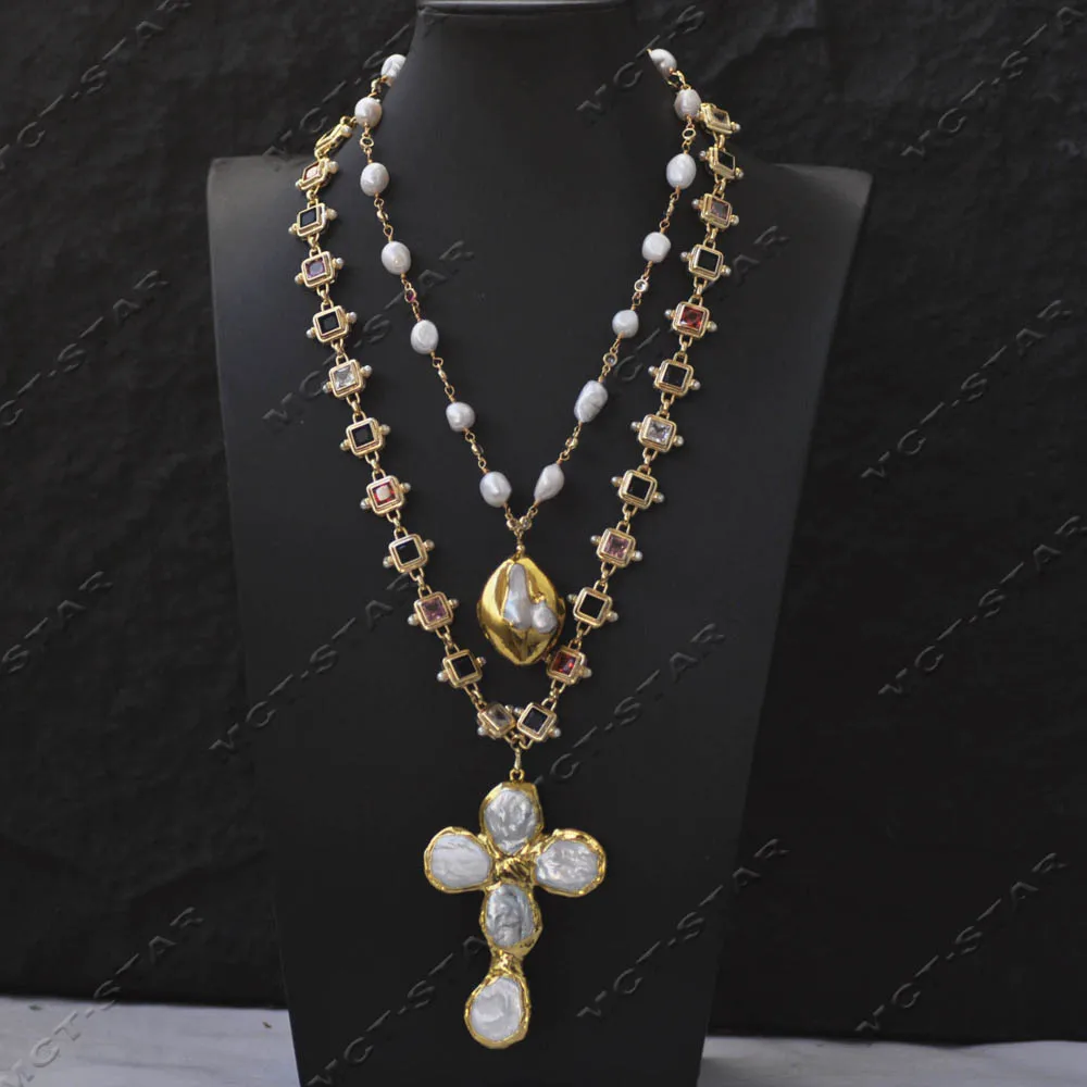 

Ожерелье-цепочка MCT·STAR с 2 нитями белого барочного жемчуга и разноцветными цирконами CZ, с подвеской в виде монеты и жемчужного креста (Z14461)