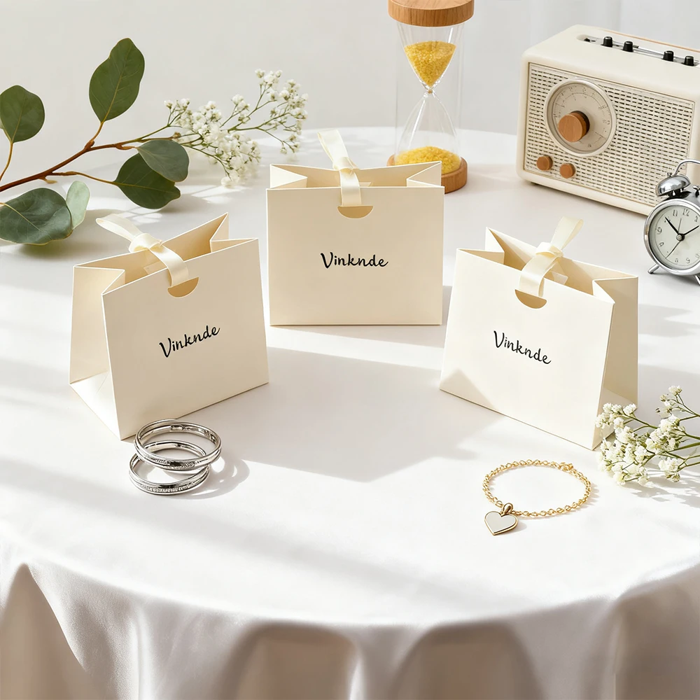 

50/80/100pcs Bulk Luxury Ribbon Handle Boutique Jewelry Perfume Shopping Packaging Bags Beige Paper Tote Bags With Your Own Logo