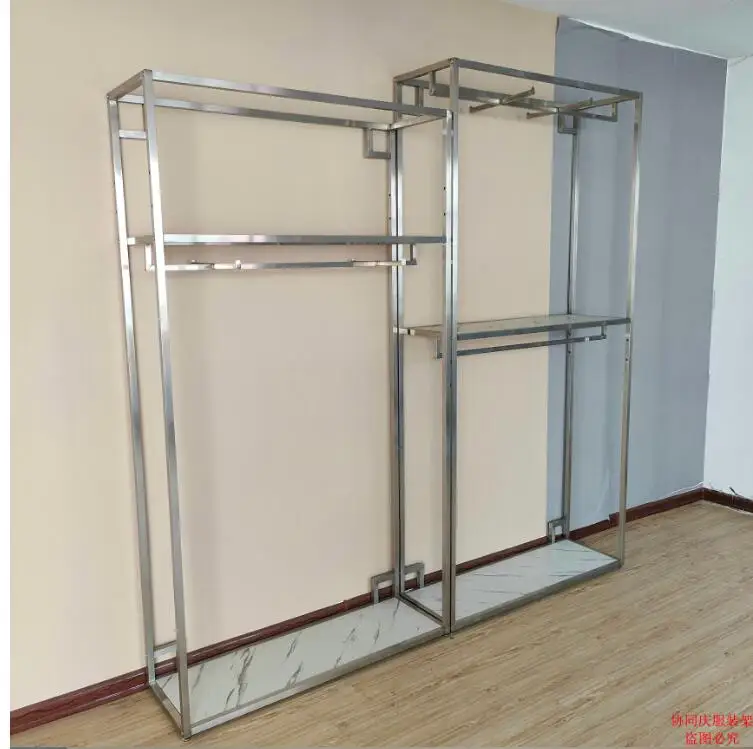 

Stainless steel brushed center island rack in boutique men's clothing store