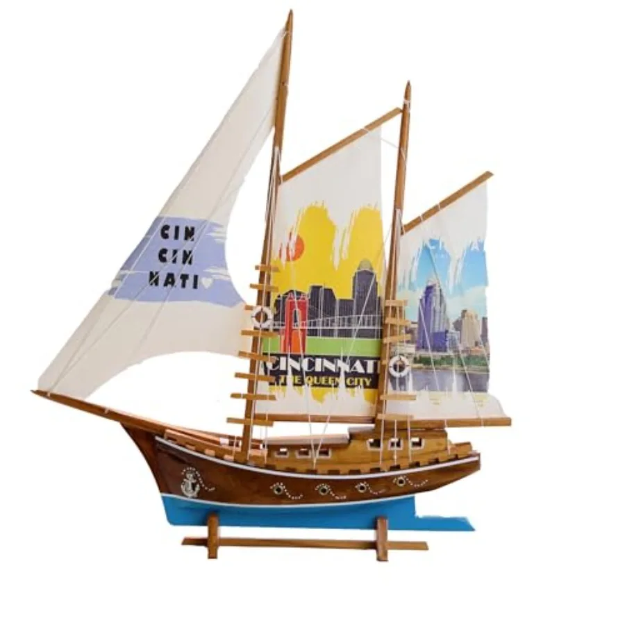 

Nautical home decor: handmade wooden sailing yacht model with Cincinnati-printed fabric sails, classic navy blue and white, tra