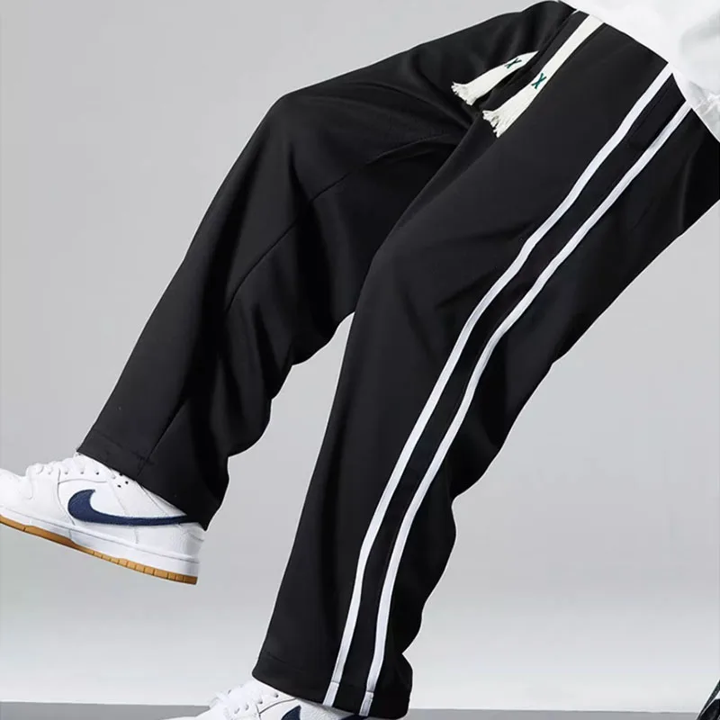 Pantaloni casual sportivi a righe versione coreana maschile della tendenza pantaloni moda gamba dritta per studenti di marca di moda allentati estivi