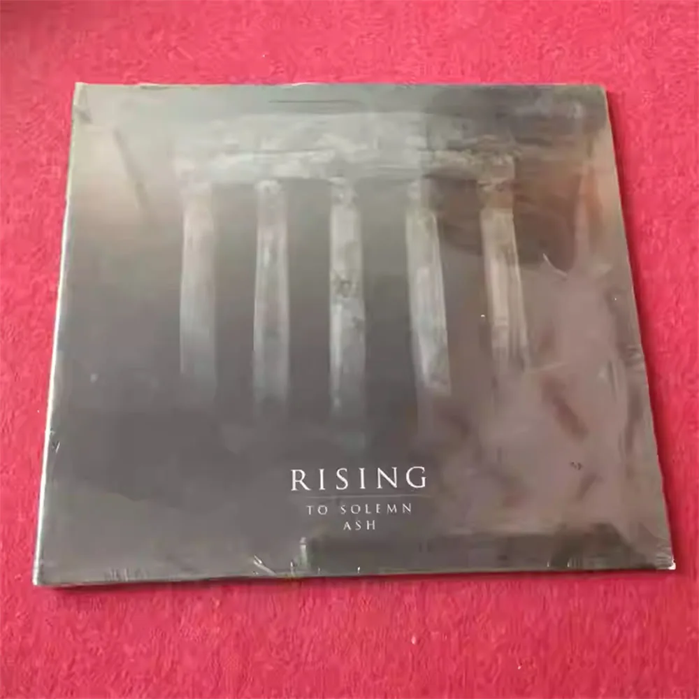 

CD 'Rising To Solemn Ash' Is The Studio Album By Danish Sludge/doom Metal Band Rising. Album Delivers A Crushing, Atmospheric