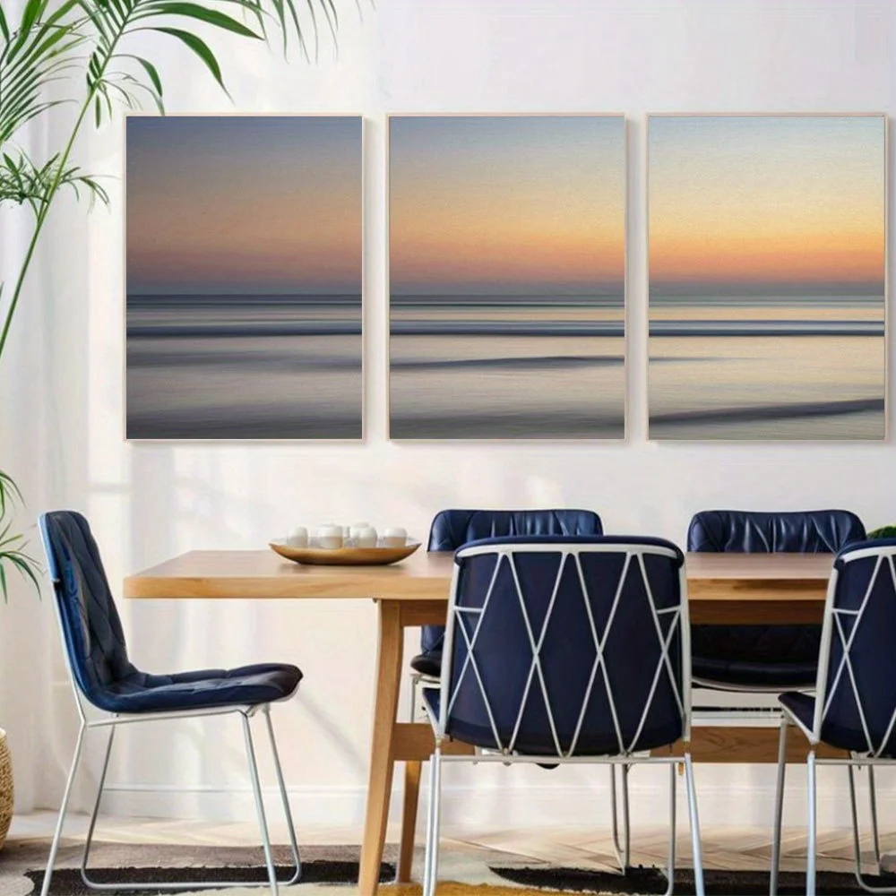 Set of 3 Unframed Canvas Prints Featuring a 2D Flat Design of an Orange And Blue Skyline by The Seashore at Dusk, Showcasing
