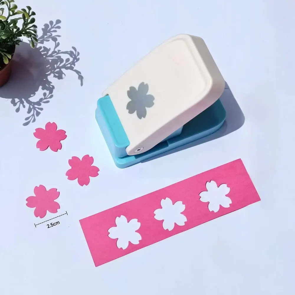 

1PC manual press punch, butterfly and cherry blossom pattern embossing tool, suitable for DIY notebooks and scrapbooks.
