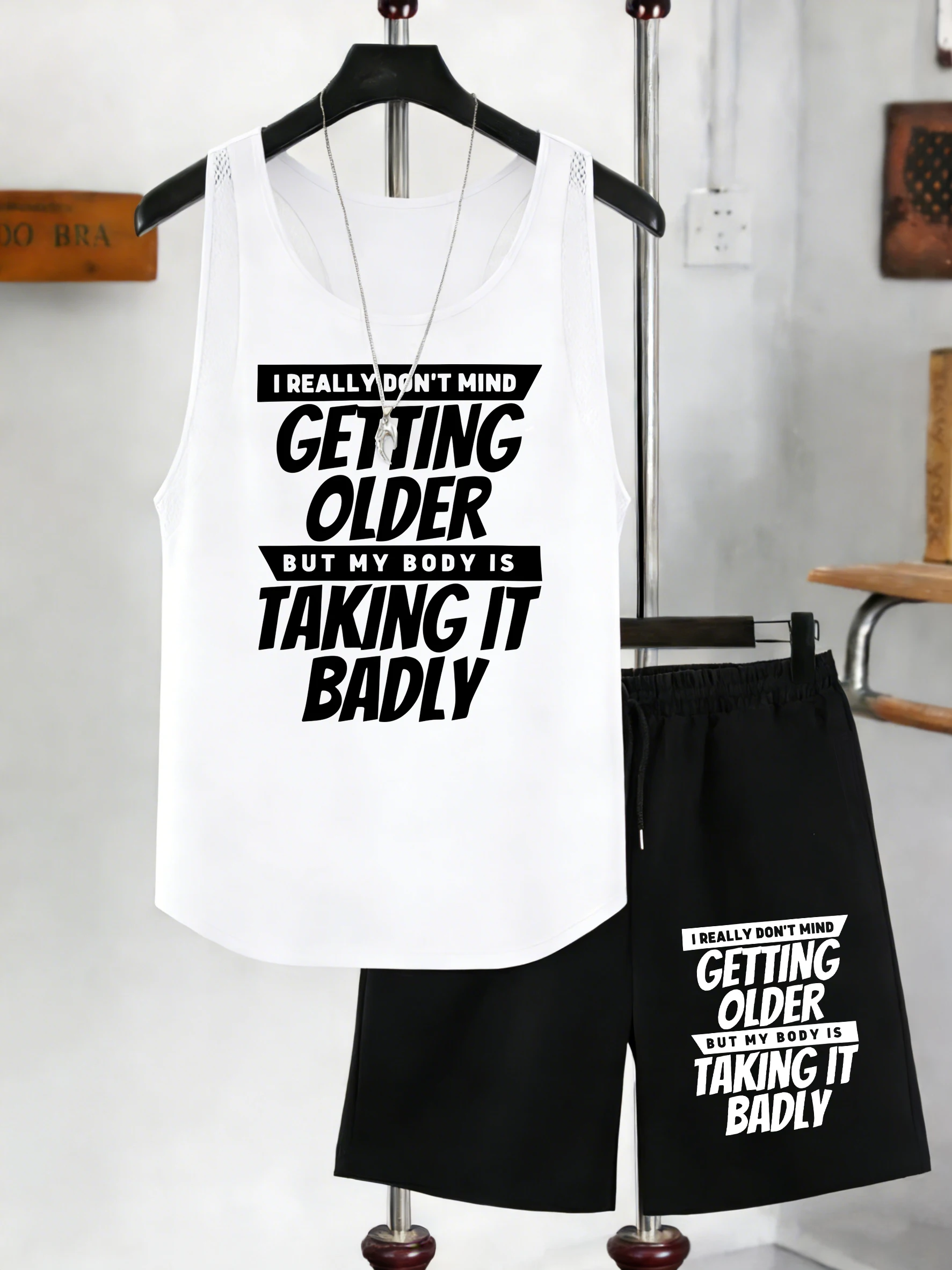 

Мужской комплект: майка с принтом «Getting Older Taking It Badly» и шорты с широкими штанинами на шнурке, летние брюки с карманами