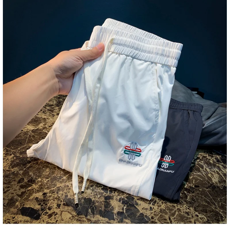 

Casual pants men's summer new elastic high-end embroidered ankle pants ultra-thin trendy sports pants