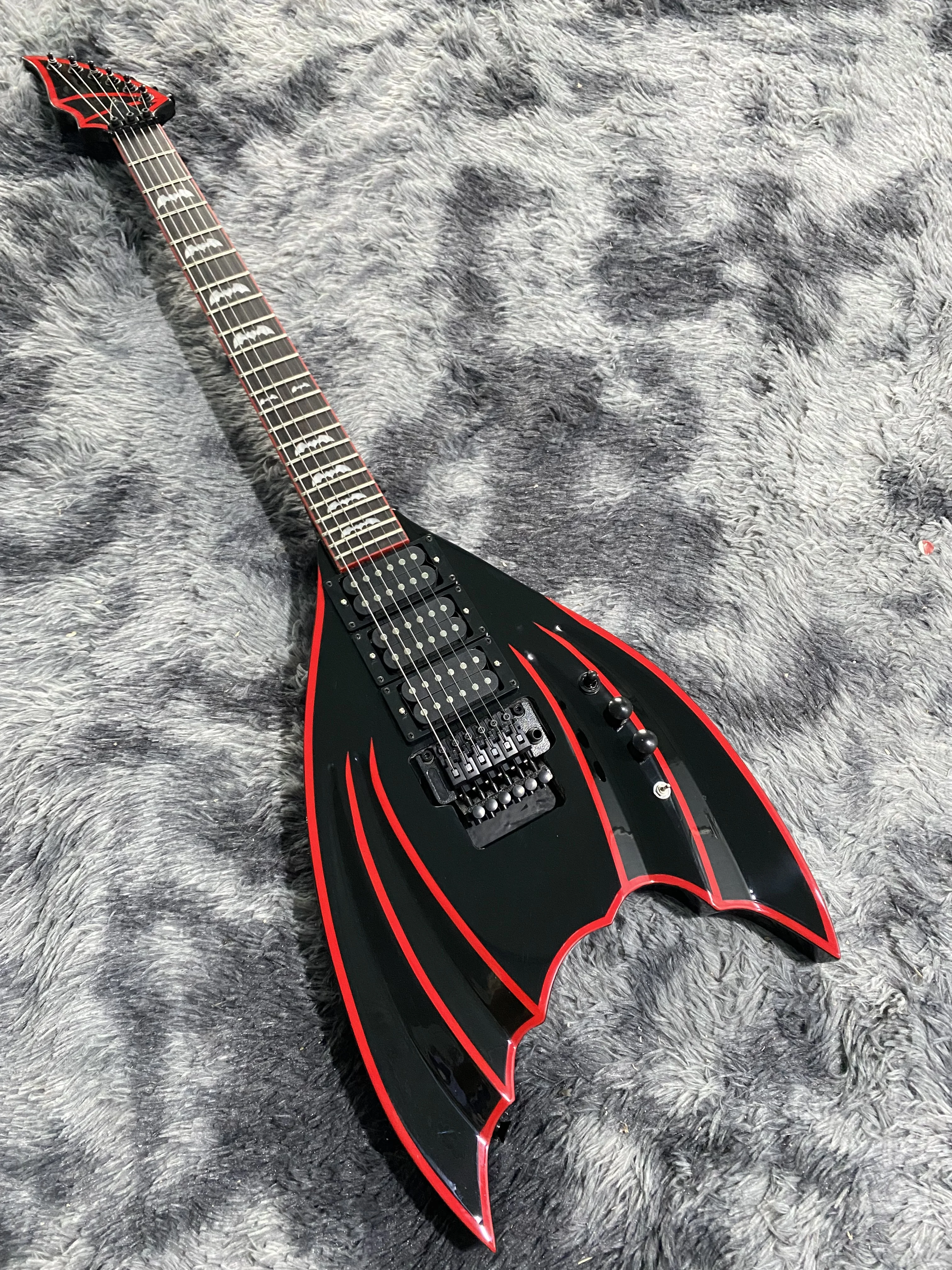 Chinese Electric Guitar Bat Shape Body Black Color Duplex tremolo System