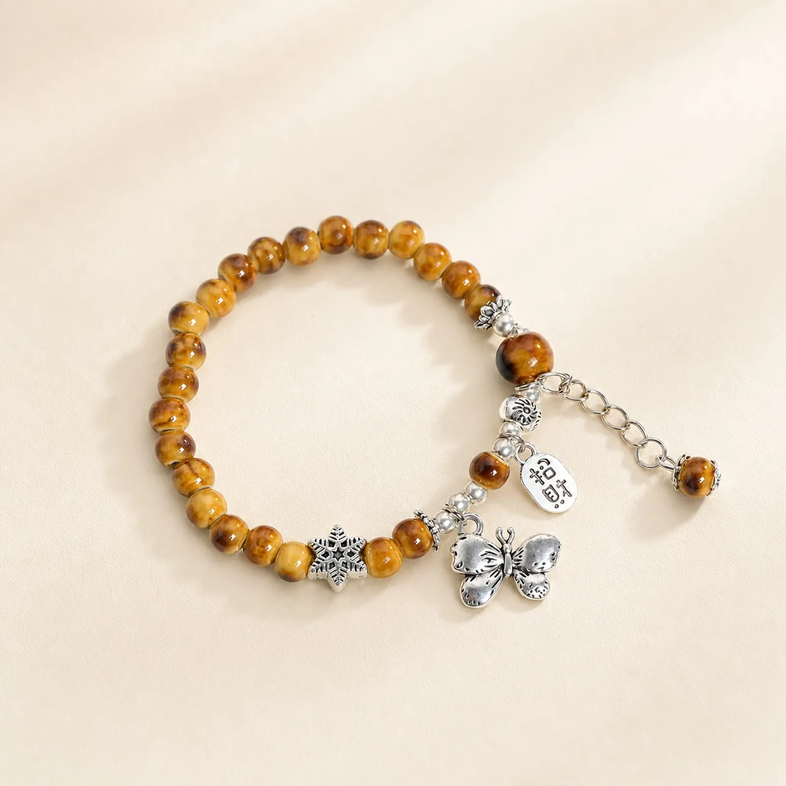 Handmade Ceramic Beaded Bracelet with Snowflake Butterfly Detail Handwoven Wax Cord and Metal Accents Y260713-02